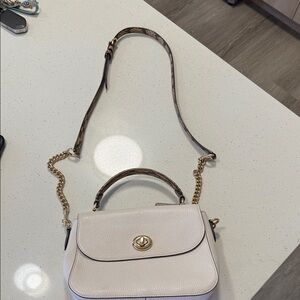 Coach Elegant Cream Handbag with Gold Accents